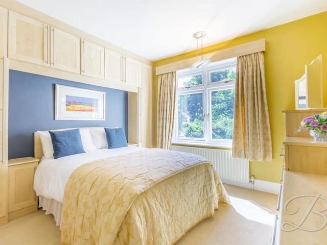 The third bedroom at the Chapel Street house overlooks the back of the property. It has fitted wardrobes and a carpeted floor.