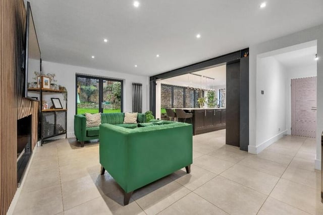 The second reception room on the ground floor of the £585,000 house is this open-plan living/dining area which, as you can see, flows seamlessly into the kitchen.