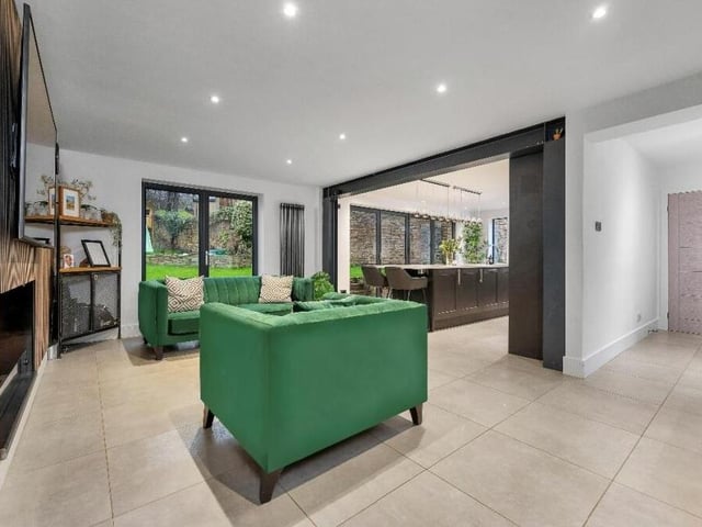 The second reception room on the ground floor of the £585,000 house is this open-plan living/dining area which, as you can see, flows seamlessly into the kitchen.