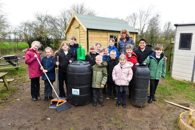 Barratt and David Wilson Homes donated £250 to King Edwin Primary School in Edwinstowe towards its outdoor area, which went towards two water butts and some compost bins to enhance the learning experience for the children. Pictured with some of the equipment and pupils from the school is teaching assistant and Eco leader Alison Fletcher.