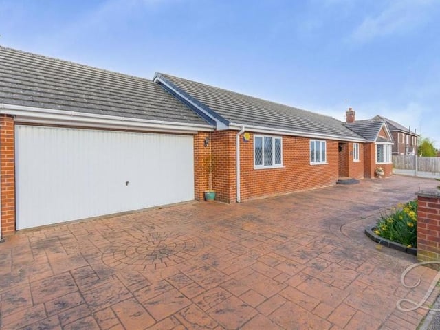 The final photo in our gallery features the property's attached garage at the front. Clearly, off-street parking space is not an issue here.