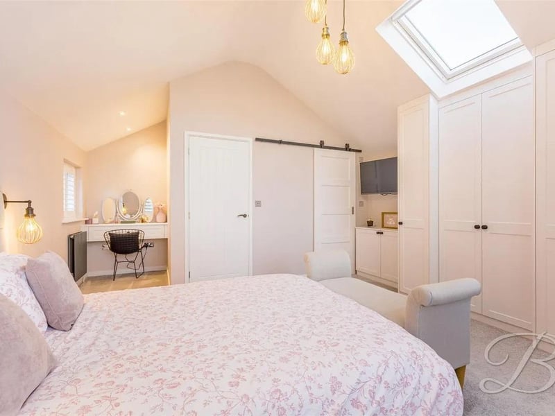 The master bedroom is bright and spacious, and features its own en-suite facility. With a window to the front elevation, window to the side elevation and a central heating radiator. There is also the benefit of fitted wardrobes.