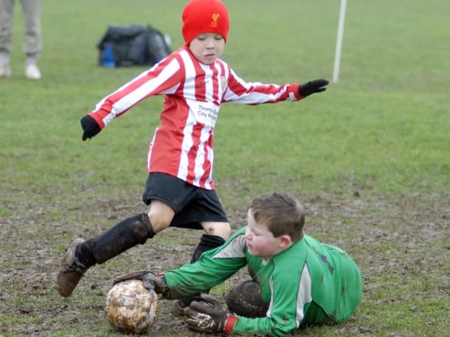 Robin Hood Colts (red and white stripes) v Woodhouse Colts U9s pictured at the Sherwood Fields ground in Edwinstowe in 2011