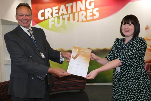 Claire received her certificate from principal Andrew Cropley