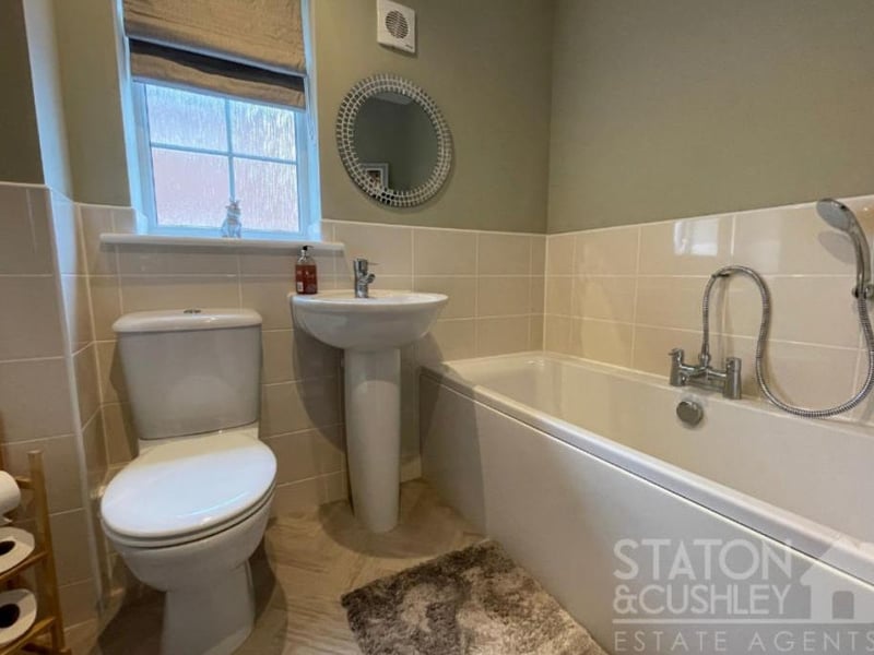 The family bathroom can be found on the first floor of the £450,000 house. It features a bath with shower attachment, low-level WC and wash hand basin.