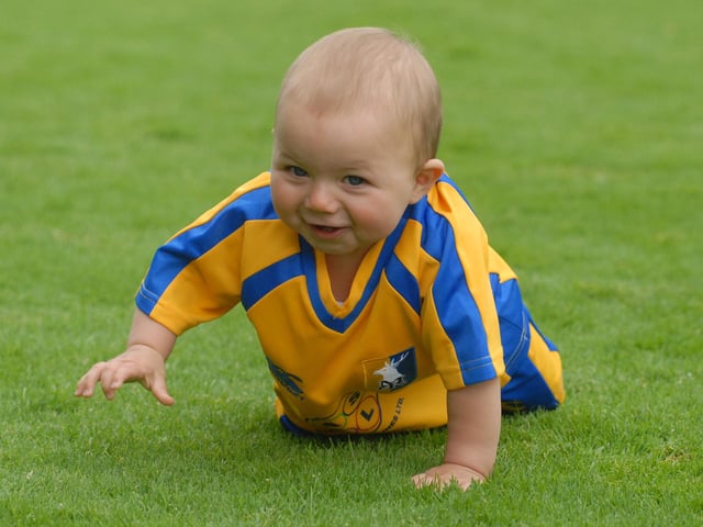 Nine month old Stags fan Finley Arnold tries out the Field Mill pitch