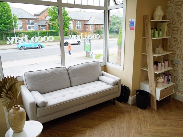 The studio is spacious, with a seating area for clients.