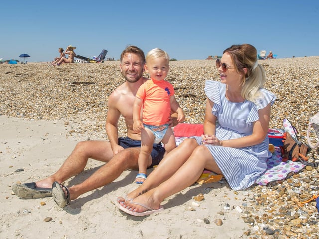 Ali and Alice Whitehouse with Franklin, 18 months on Eastern Parade beach. Picture: Habibur Rahman