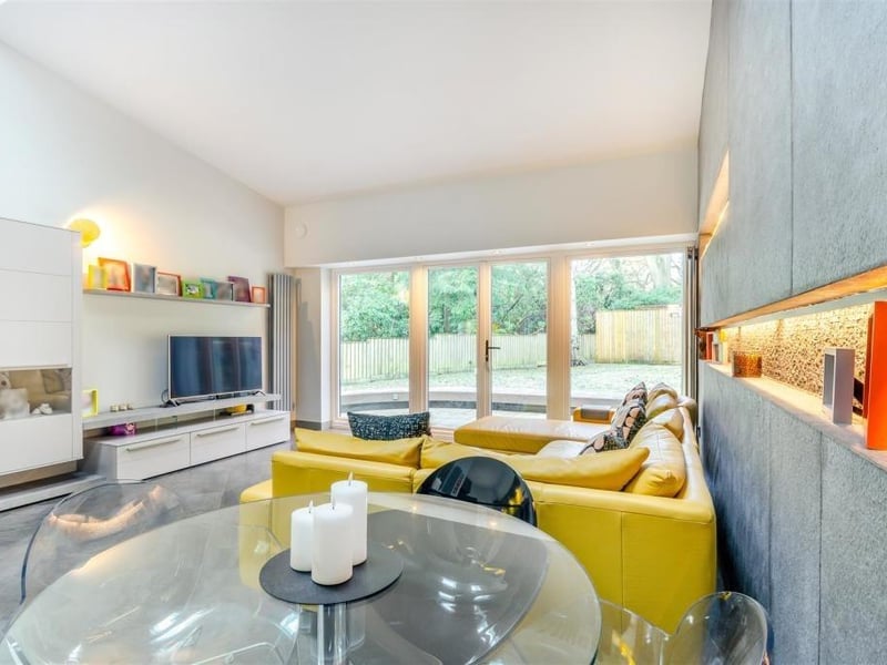 The living area is very bright thanks largely to French doors that lead out to the back garden. A fitted Gwinner media storage unit, 12'8" vaulted ceiling and contemporary, vertical radiators add to the appeal.
