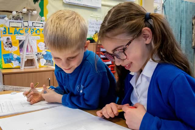 Children at work at Mapplewells Primary and Nursery School in Sutton.