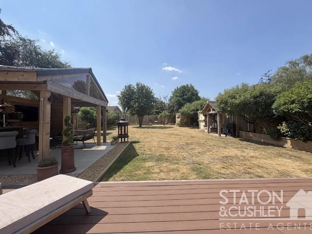 The beautifully landscaped south-facing rear garden has been thoughtfully designed to provide the perfect balance of relaxation and entertaining