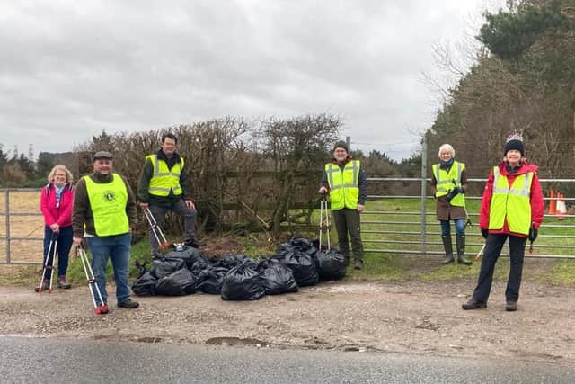 Litter pickers get to work