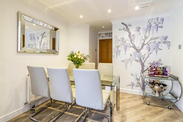Also adjoining the kitchen at the £750,000 property is this stylish dining area.