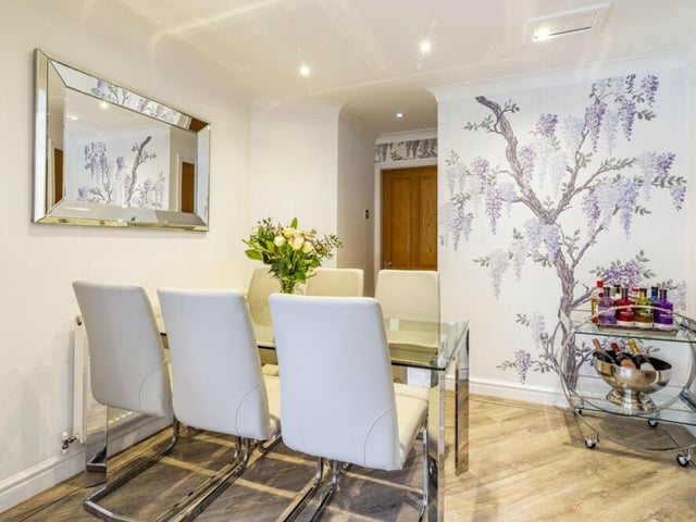 Also adjoining the kitchen at the £750,000 property is this stylish dining area.