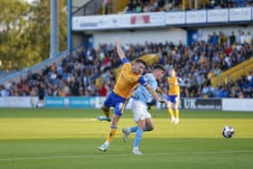 Mansfield Town midfielder Ollie Clarke in the thick of it tonight. Photo by Chris HOLLOWAY / The Bigger Picture.media