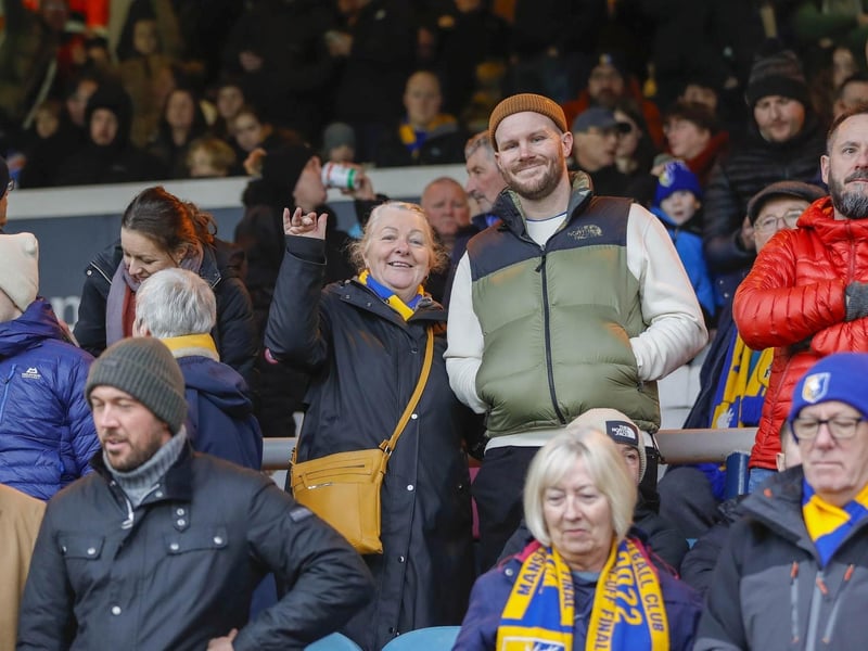 Mansfield Town fans watch the brilliant win at Peterborough United.
