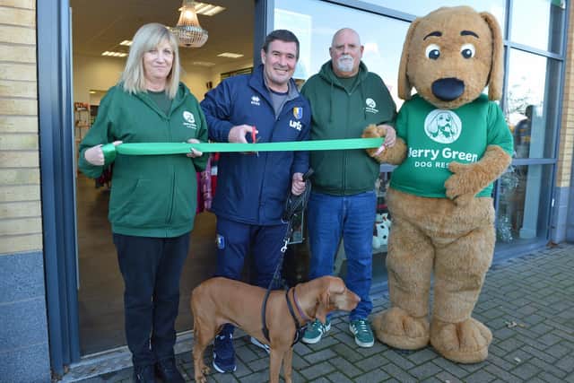 Jerry Green dog rescue shop in Forest Town. Denise Howard,shop manager, Mansfield Town manager Nigel Clough, Jason Hutchinson deputy shop manager and Jerry Green dog rescue mascot.