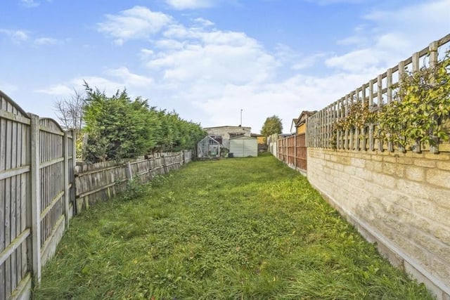 Our last photo shows the lengthy back garden, which is mainly laid to lawn and is also enclosed with a fenced boundary.