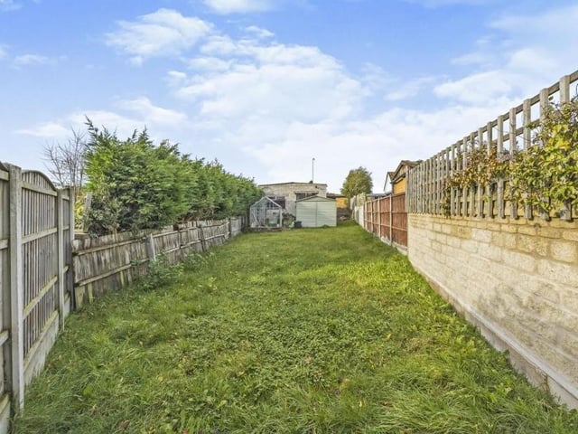 Our last photo shows the lengthy back garden, which is mainly laid to lawn and is also enclosed with a fenced boundary.