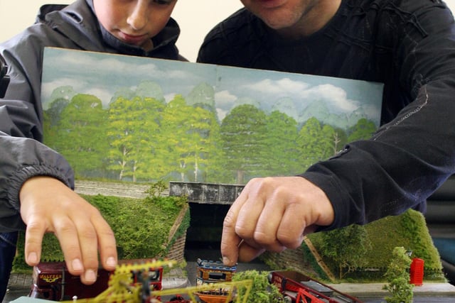 Ashley Booth,11, of Barnsley and his father Paul attend to their simulation of a 70's fairground moving on at the Models Exhibition, Crich Tramway Museum in 2007