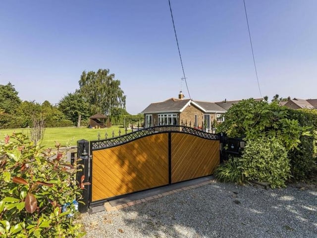 The bungalow is as much about the exterior, and its plot spanning three-quarters of an acre, as it is the interior. So these next few photos should give you an idea of what's an offer. Electrically-controlled gates lead on to the plot and also guarantee privacy and security.