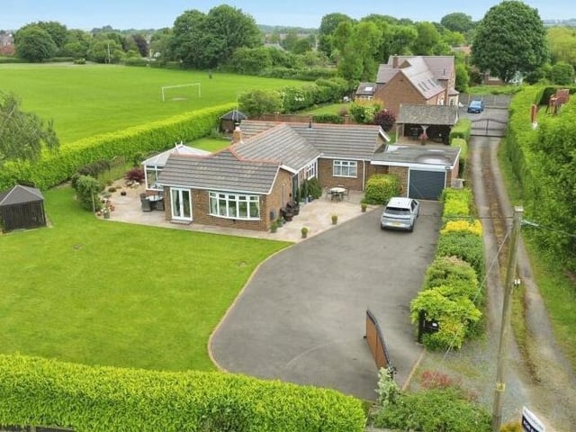 We close this gallery as we opened it -- with a view from the skies. This is a drone shot, showing the front of the bungalow, which is clearly set within a peaceful and picturesque area of Kirkby.