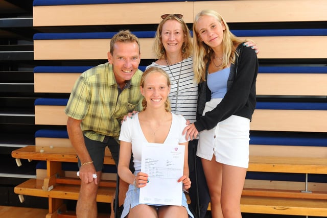 Pictured is: (seated) Maddy Oliver who got five 8s, 2 A*s, 2 A's and one 9 with her family (l-r) dad Graeme (47), mum Bonny (51) and sister Beatrice (15) at at Portsmouth High School in Southsea. Picture: Sarah Standing (200820-2924)