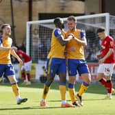 Mansfield Town celebrate during the win at Swindon Town.