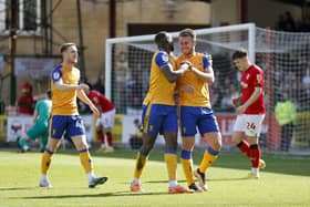 Mansfield Town celebrate during the win at Swindon Town.