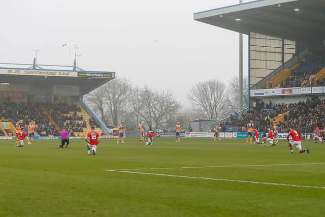 Players and officials take the knee prior to kick-off against Walsall. Photo by Chris Holloway / The Bigger Picture.media
