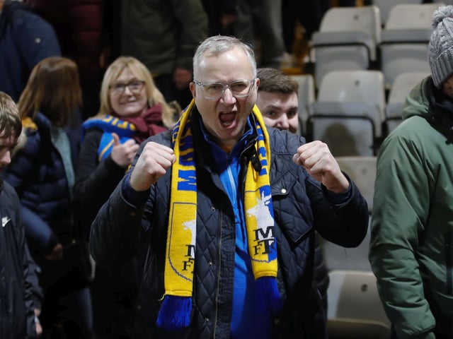 Mansfield Town progressed in the FA Cup thanks to Stephen McLaughlin's second half goal.