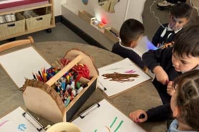 Children in the new TTS-created art area at Greenwood Primary and Nursery School. Photo: Submitted