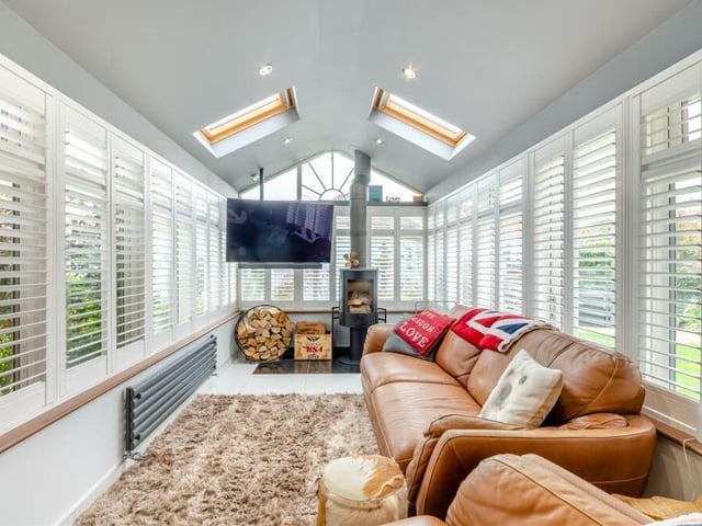 The garden room is a gorgeous, relaxing space at the back of the £500,000 Sutton property. Extensive windows, plus two Velux roof windows in a nine-foot vaulted ceiling, allow an abundance of natural daylight into the room, while a Contura log-burner provides the cosy warmth.