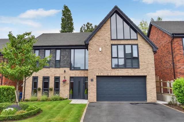 The striking facade of the five-bedroom, detached house at Rockcliffe Grange in Berry Hill, Mansfield. Offers in excess of £575,000 are invited by Ravenshead-based estate agents Gascoines.