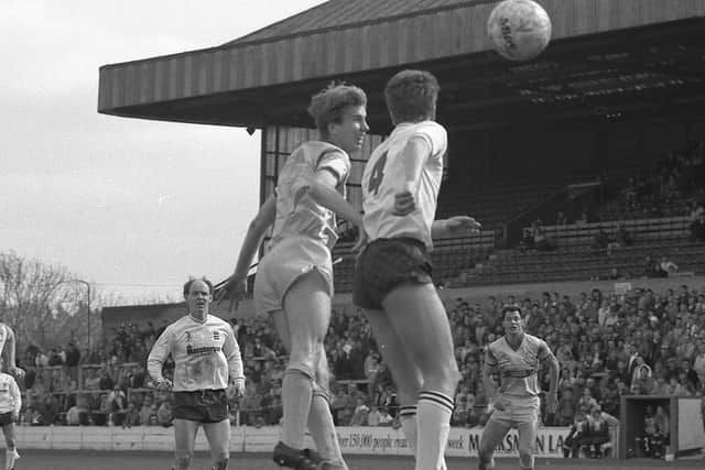 Simon Coleman challenges in the air for Mansfield against Bury in 1988.