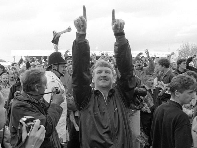 Manager George Foster celebrates promotion after Stags beat Rochdale 2-1.