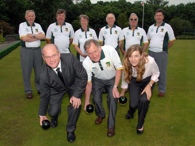 Members of Teversal Grange Bowls Club celebrate after they gained a shirt sponsor. Ken Gregory and Sons Funeral Directors supplied the club with new shirts. Pictured is Club Chairman Harry Johnson, centre, with Gregory Concultants Peter Gregory, left, and Helen Gregory, right, watched by club members.