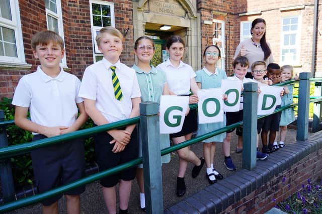 Headteacher Stephanie Astle celebrates the good Ofsted report with pupils.