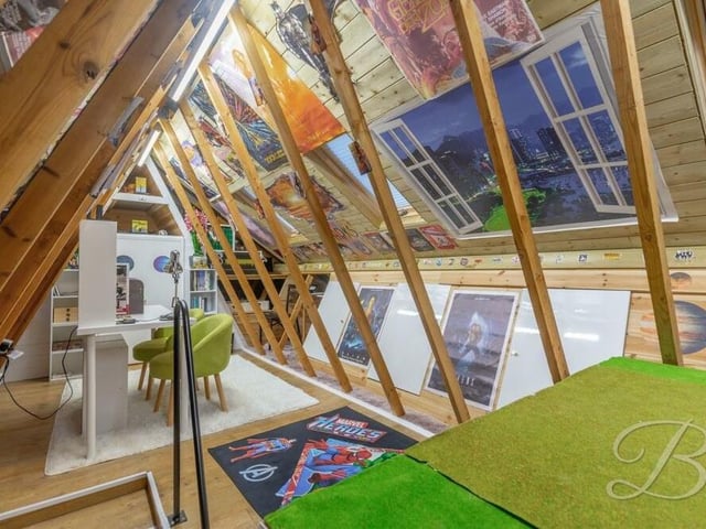 Before we move on to the five bedrooms, we may as well look at the loft, which has been converted into an additional living area, with storage space. There are seven Velux windows with blinds, and four strip lights.