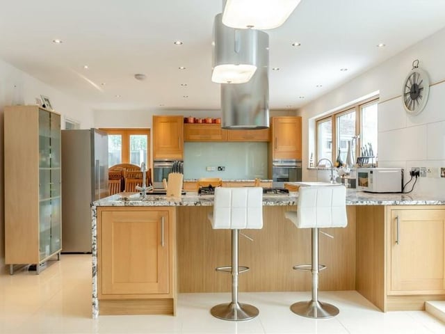 Another shot of the kitchen, which benefits from mood lighting beneath the cupboards and base units, a porcelain tiled floor and underfloor heating.