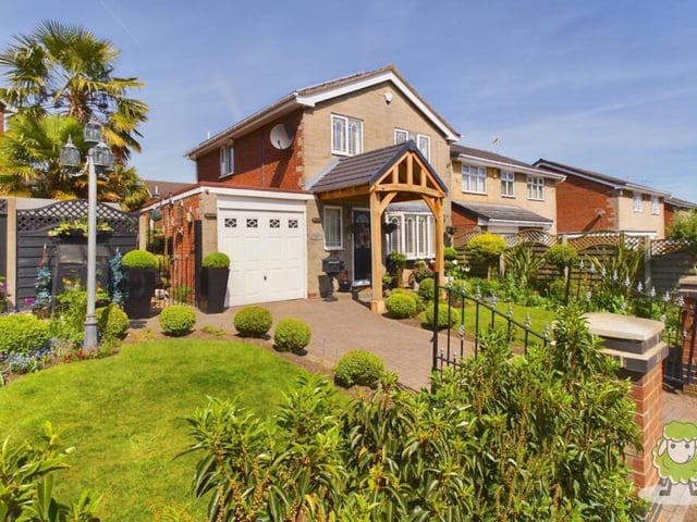 The attractive gardens are not confined to the back of the property. The front is also graced with beautifully presented lawns, plants, shrubbery and trees.