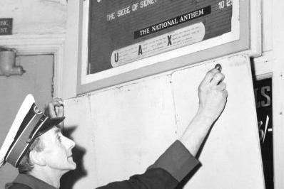 Staff member Edwin Causer puts the shutters up for a final time in 1961.