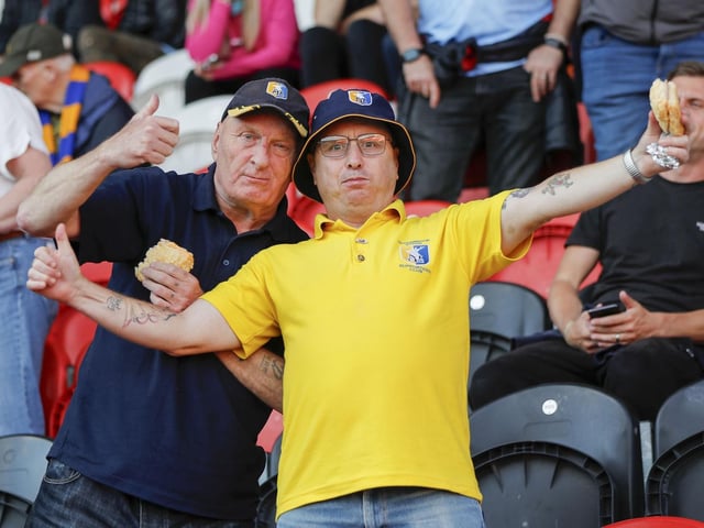 Mansfield Town fans watch the 2-2 draw at Doncaster..
