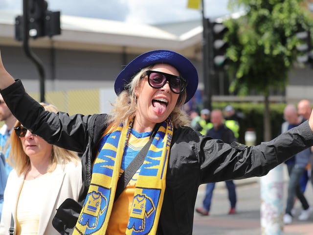 Mansfield Town fans watch the drama unfold inside Wembley.