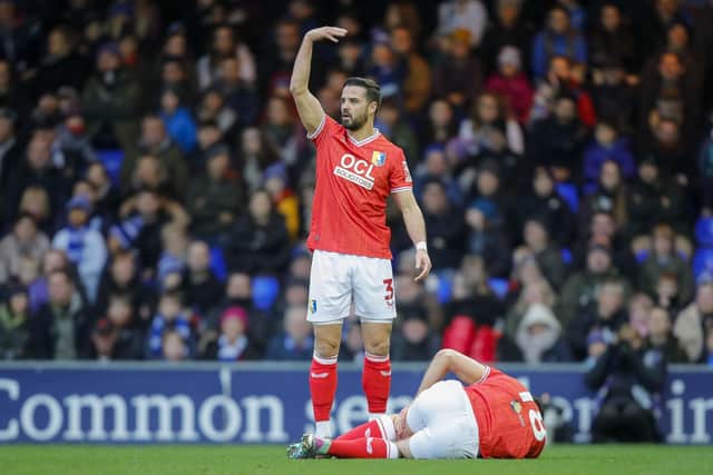 Stephen McLaughlin (03) calls for assistance for the injured Rhys Oates (18) during the Sky Bet League 2 match against Stockport County FC at Edgeley Park, 01 Jan 2024.
Photo credit should read : Chris & Jeanette Holloway / The Bigger Picture.media