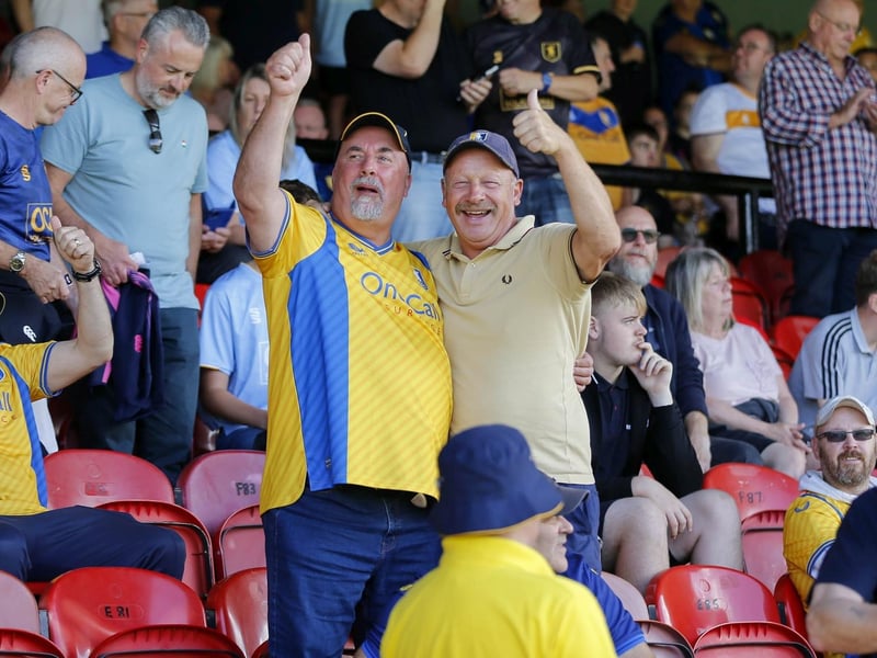 Mansfield Town fans watch the 1-1 draw at Grimsby in League Two.