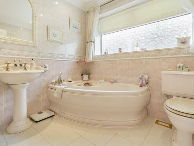 The main bathroom injects more luxury into the bungalow, especially its fabulous corner bath with mixer tap and shower handset. It's a modern, four-piece suite with brass fittings and also includes a pedestal wash hand basin and low-flush WC.