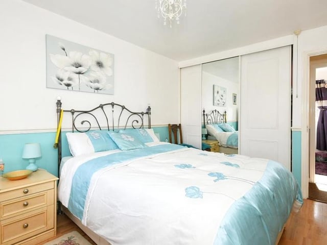 Let's go upstairs now to the first floor of the Forest Town house - and here is the impressive master bedroom. It includes fitted wardrobes and its own en suite shower room.