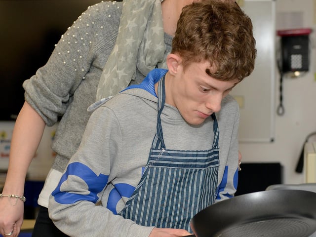 Pancake competiton at Dawn House School with cookery demonstration with Masterchef's Tom Moody, pictured is Thomas making his pancake