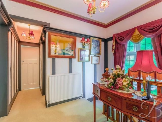 At the top of the stairs, you are greeted by this lovely landing, which has a carpeted floor and traditional decor.